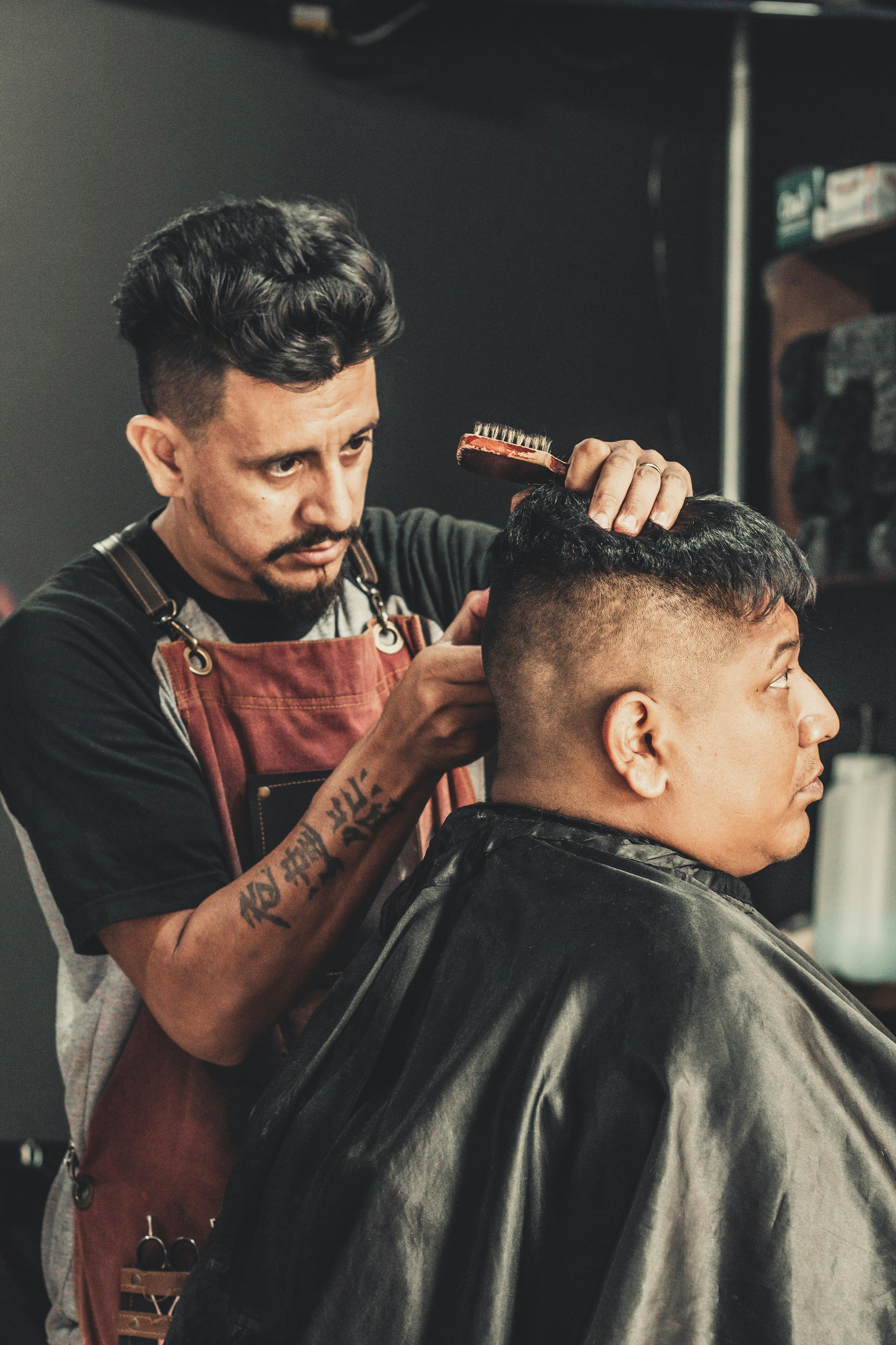 barbers cutting hair